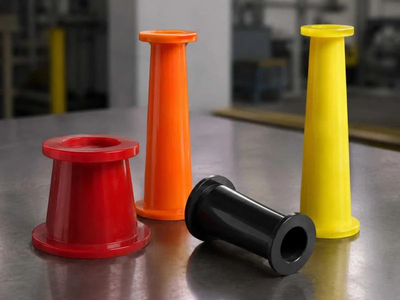 Toberas de poliuretano para shotcrete en rojo, naranja, negro y amarillo